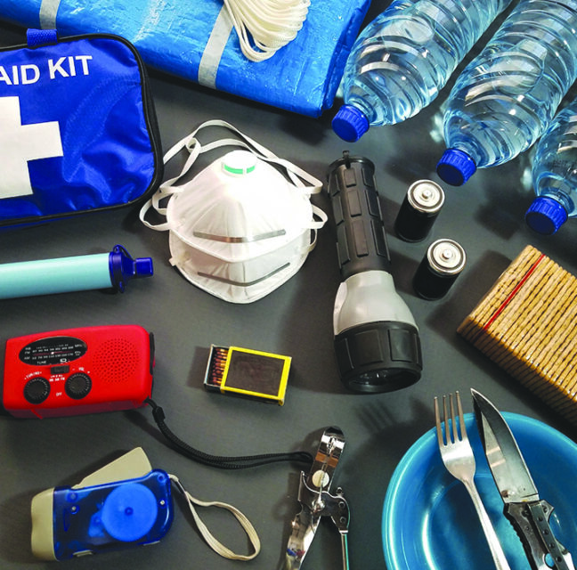 Hurricane emergency supplies including water, batteries and flashlights