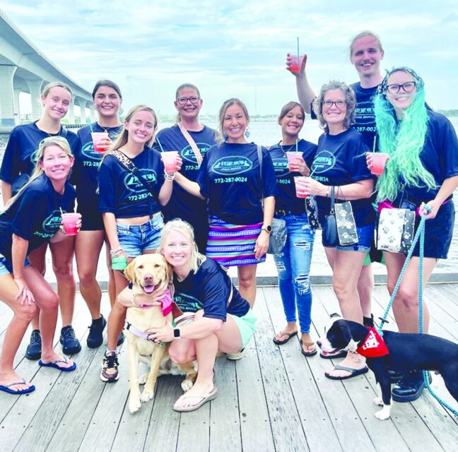 Stuart Sound Animal Hospital staff with their dogs at a past Pup Crawl