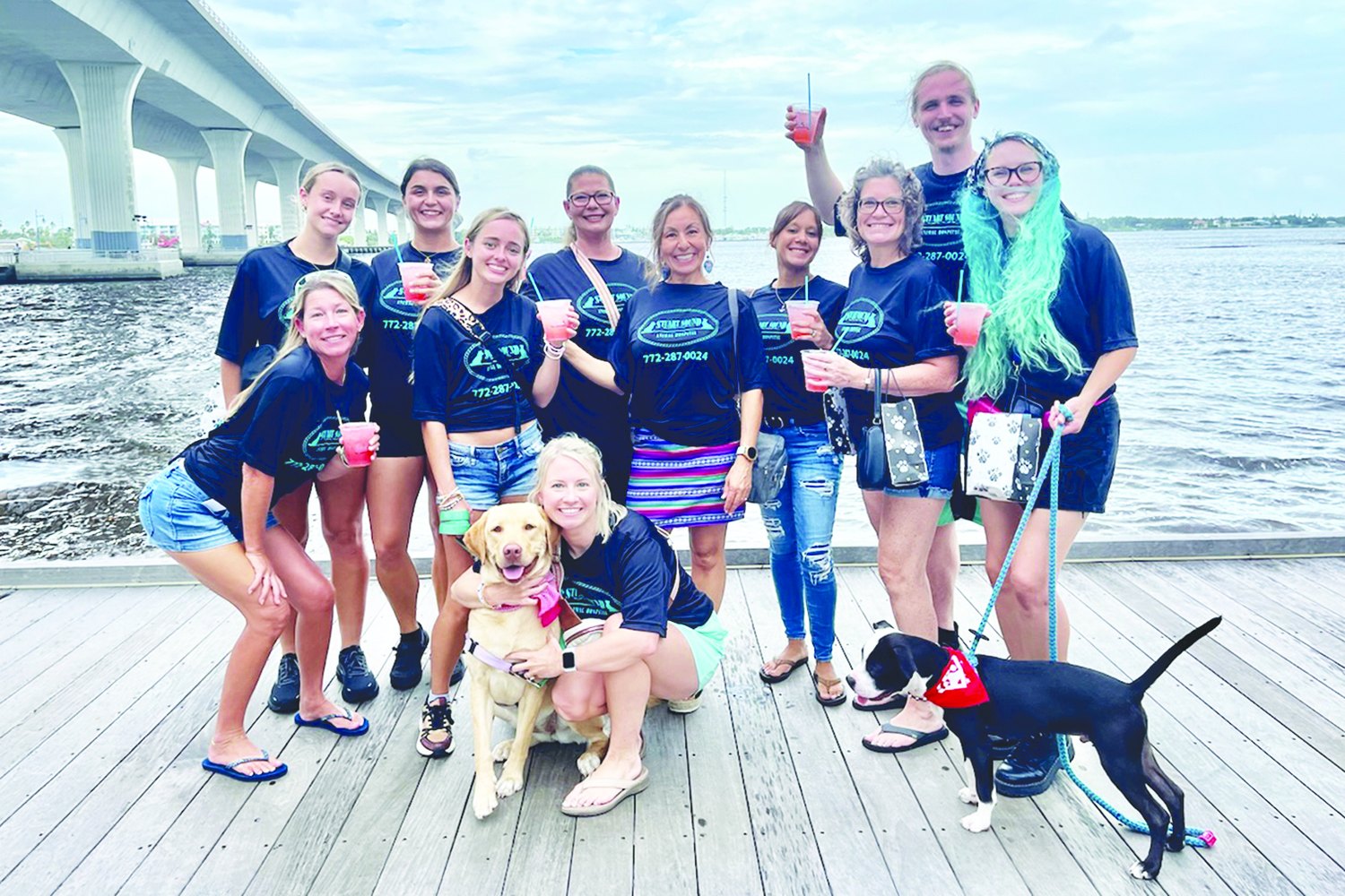 Stuart Sound Animal Hospital staff with their dogs at a past Pup Crawl