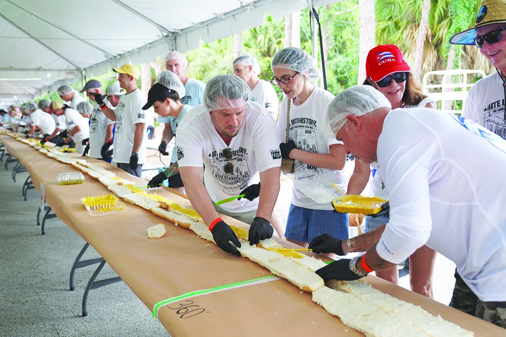 Volunteers assembling a section of the 400-foot Cuban sandwich