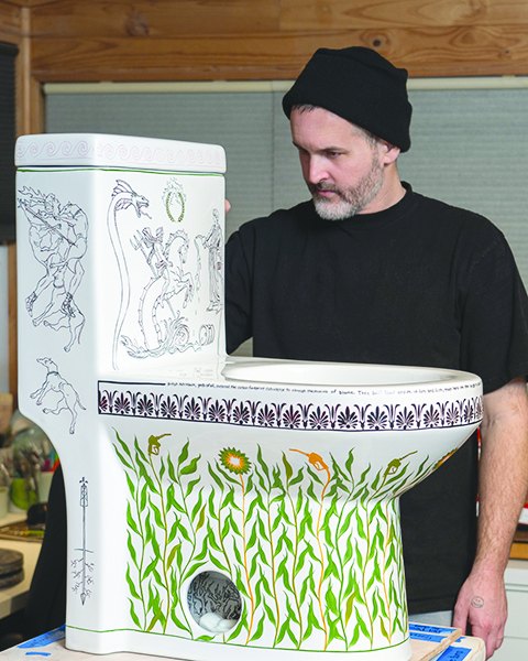 Bradley Klem with a hand-painted porcelain toilet